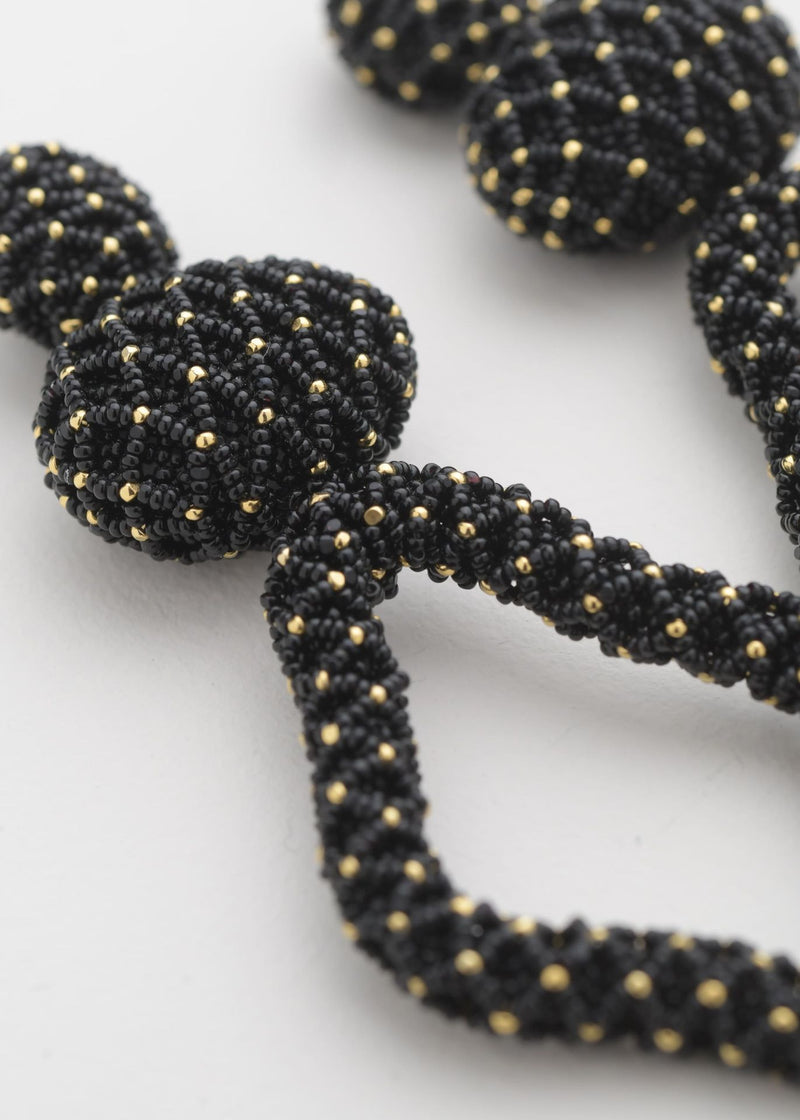 ARETES HAUTE TEJIDO ABIERTO TAWARI ORO NEGRO