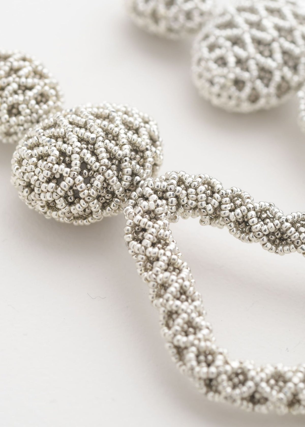 TAWARI OPEN WEAVE HAUTE EARRINGS PLATINUM SILVER
