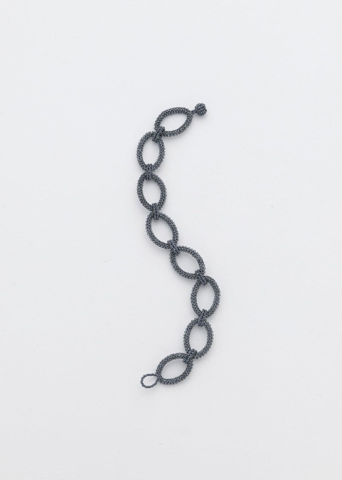 BRAZALETE AROS TAWARI GRIS METALICO