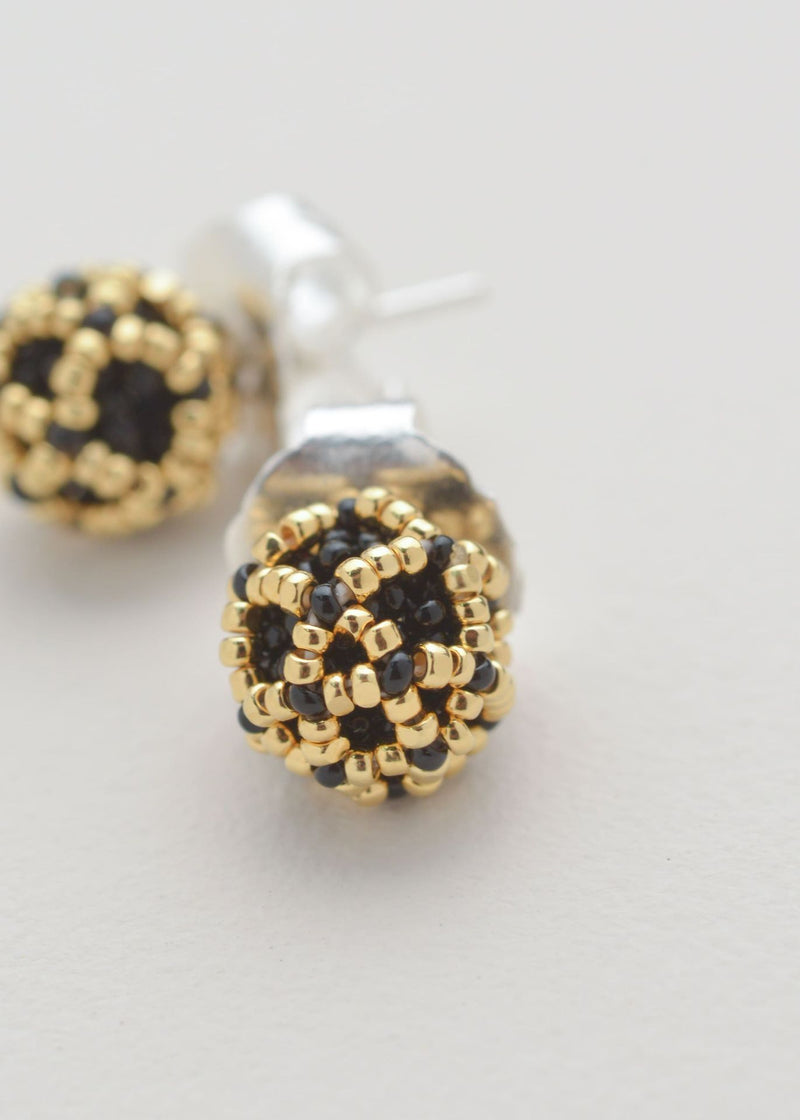 BROQUELES NAWI ORO NEGRO