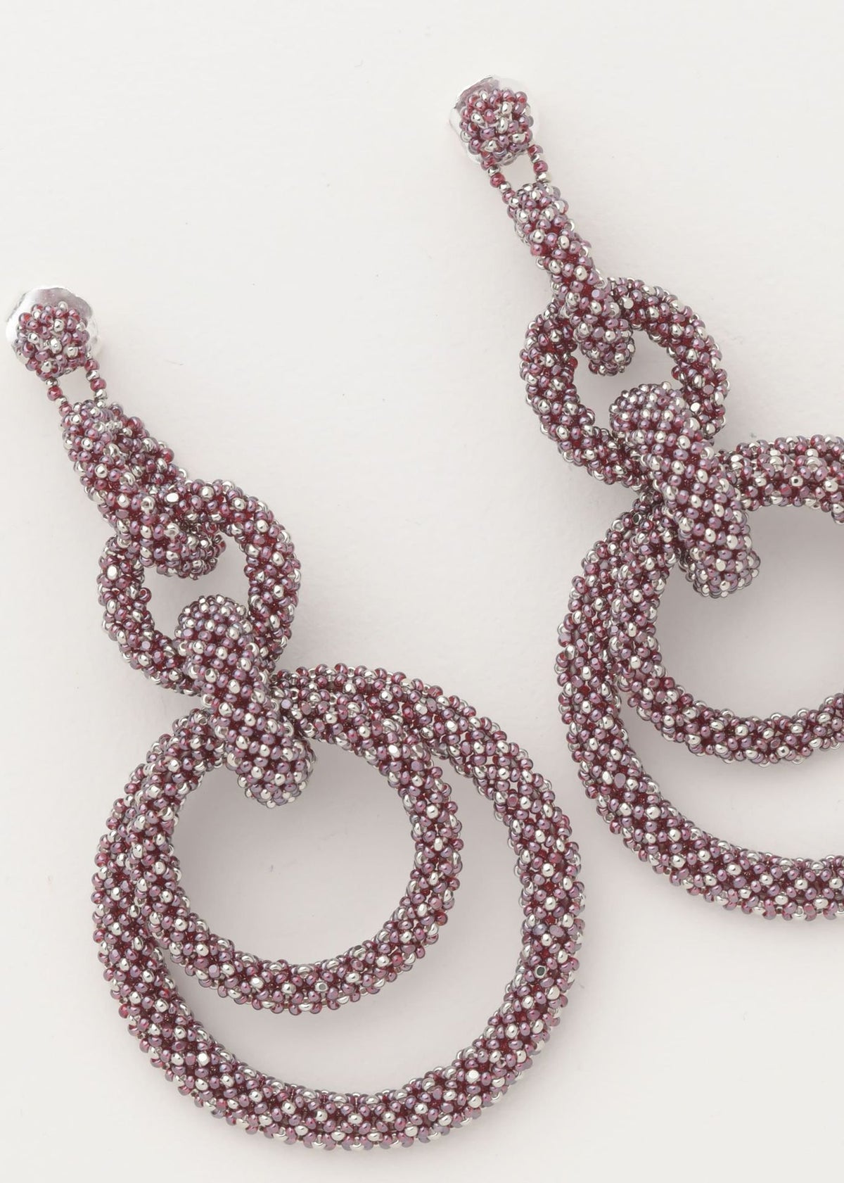 ARETES CINCO AROS CADENA PLATINO TG GARNET LUSTRE