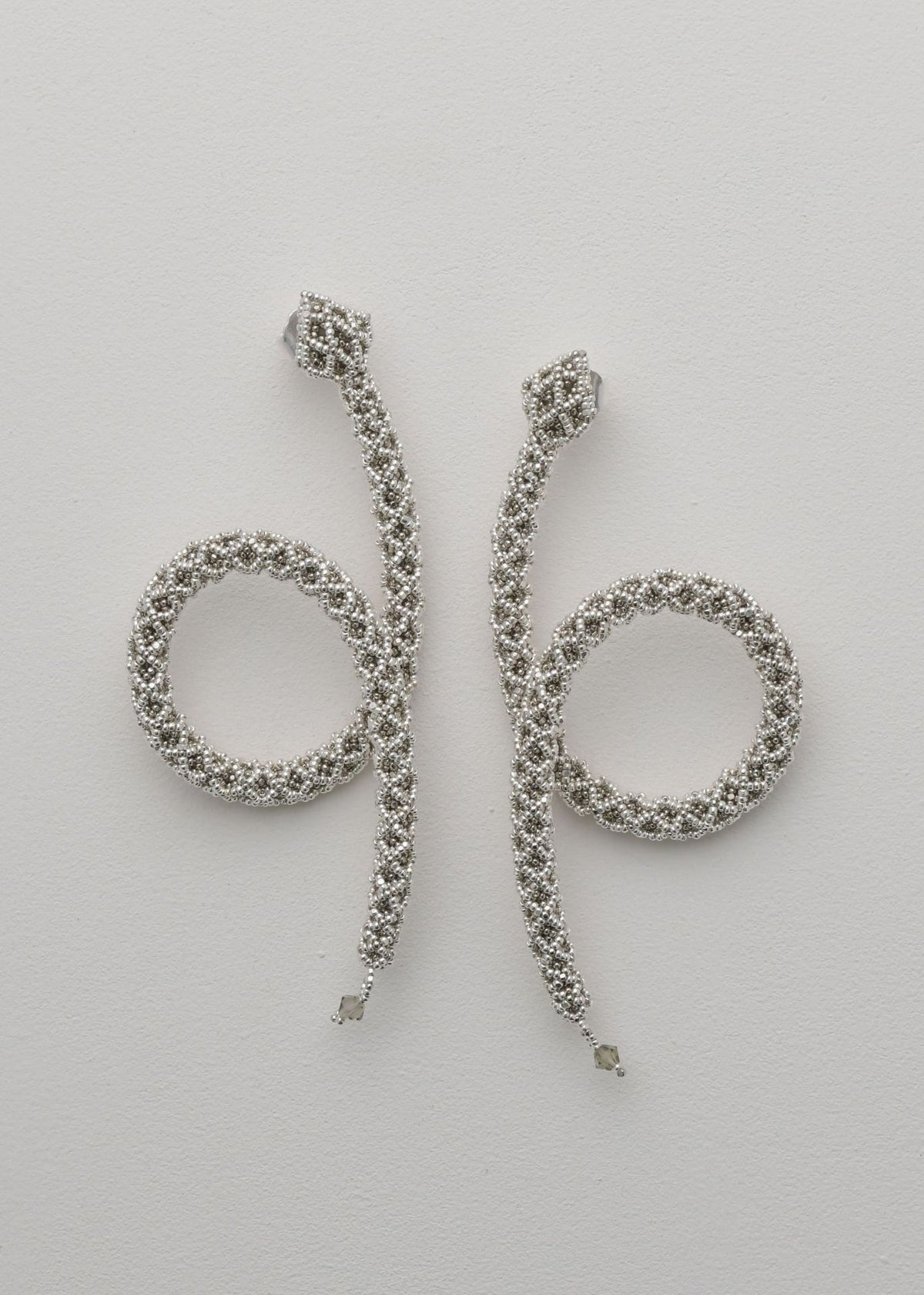 NAWI PLATINUM SILVER SNAKE LOOP EARRINGS