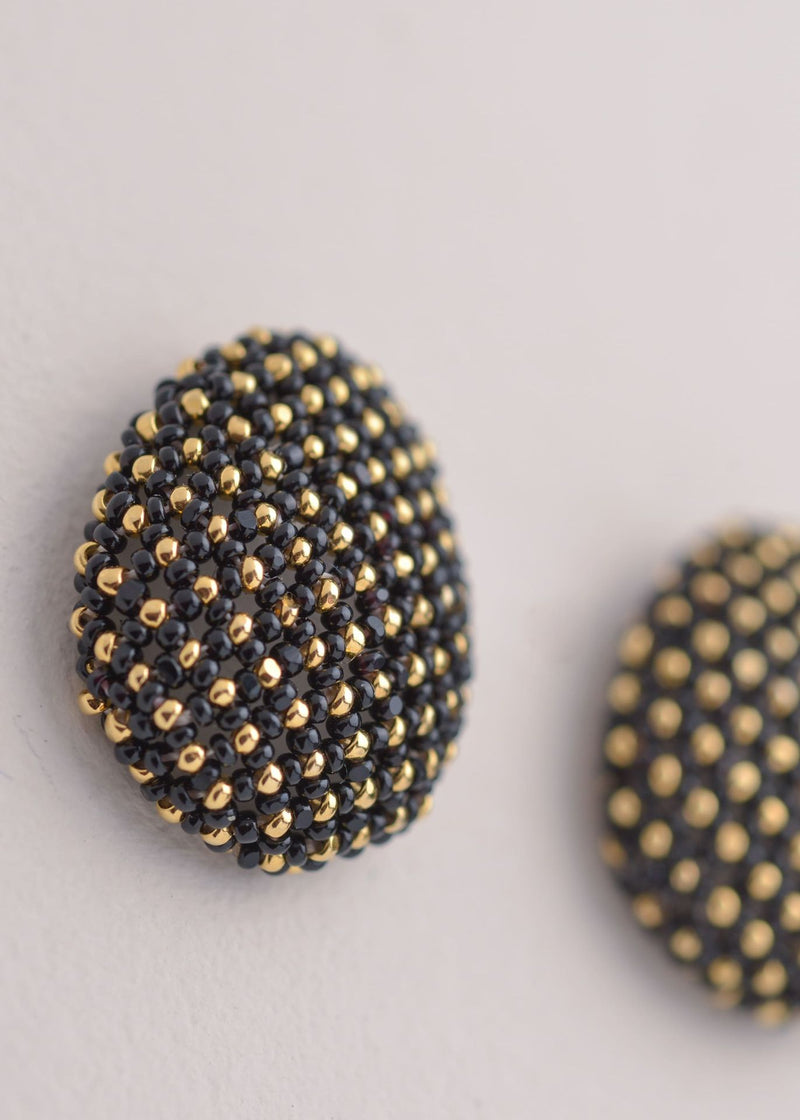 BROQUELES TAWARI ORO NEGRO