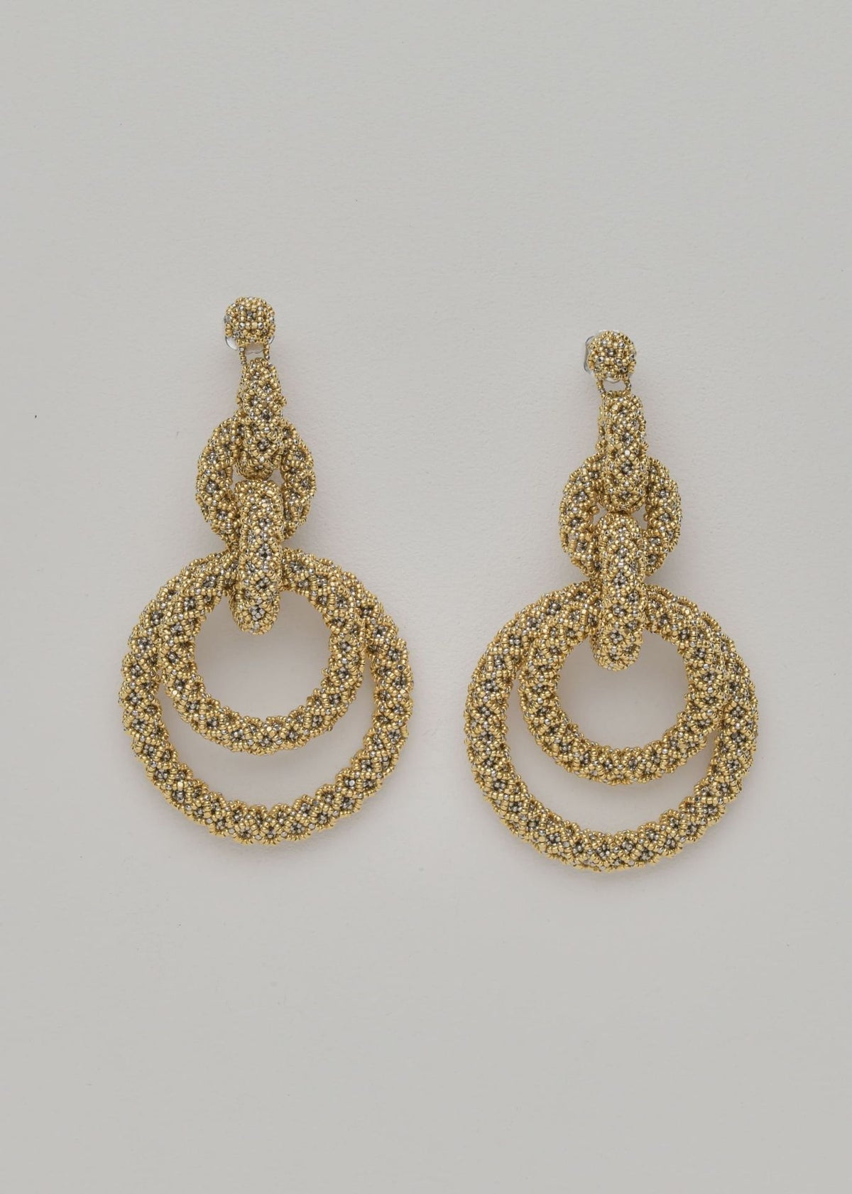 ARETES CINCO AROS NAWI ORO PLATINO