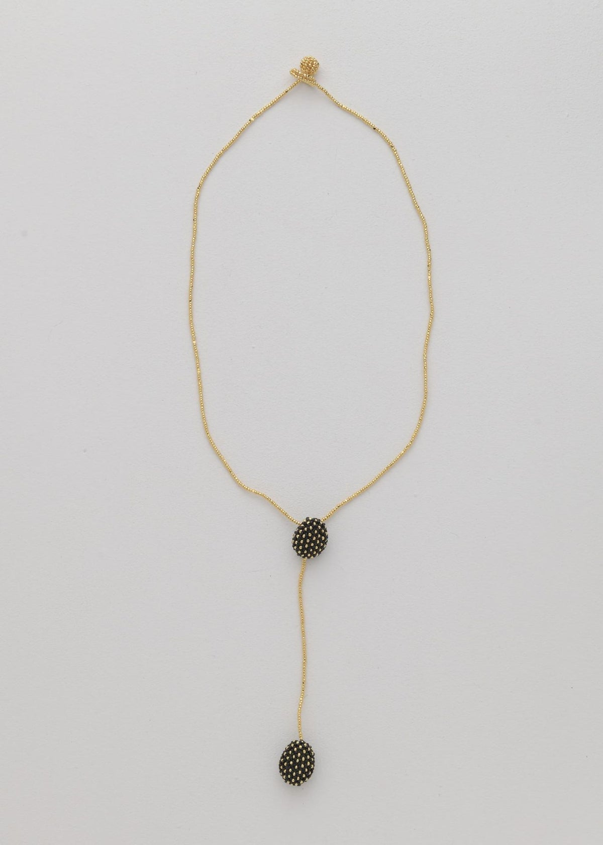 COLLAR DOS TAWARI ORO NEGRO